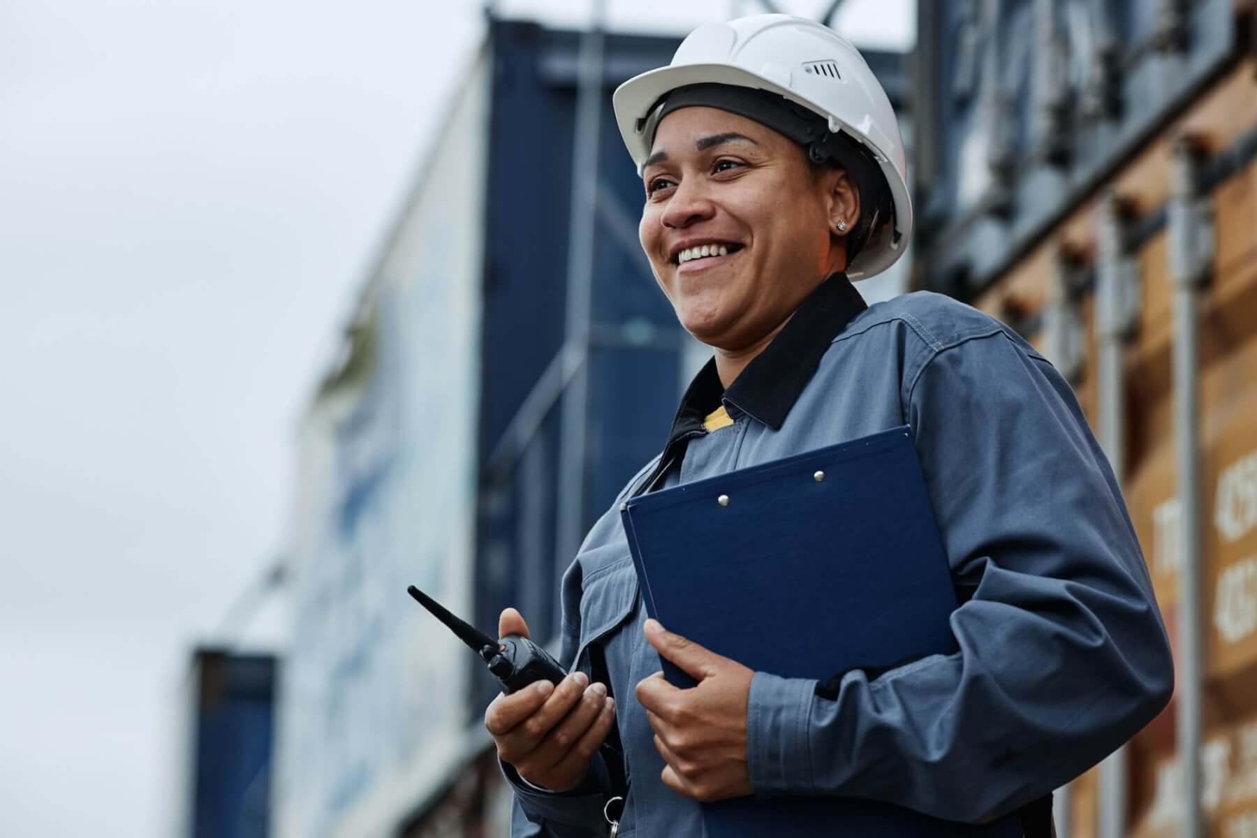 woman-working-at-shipping-docks-with-containers.jpg